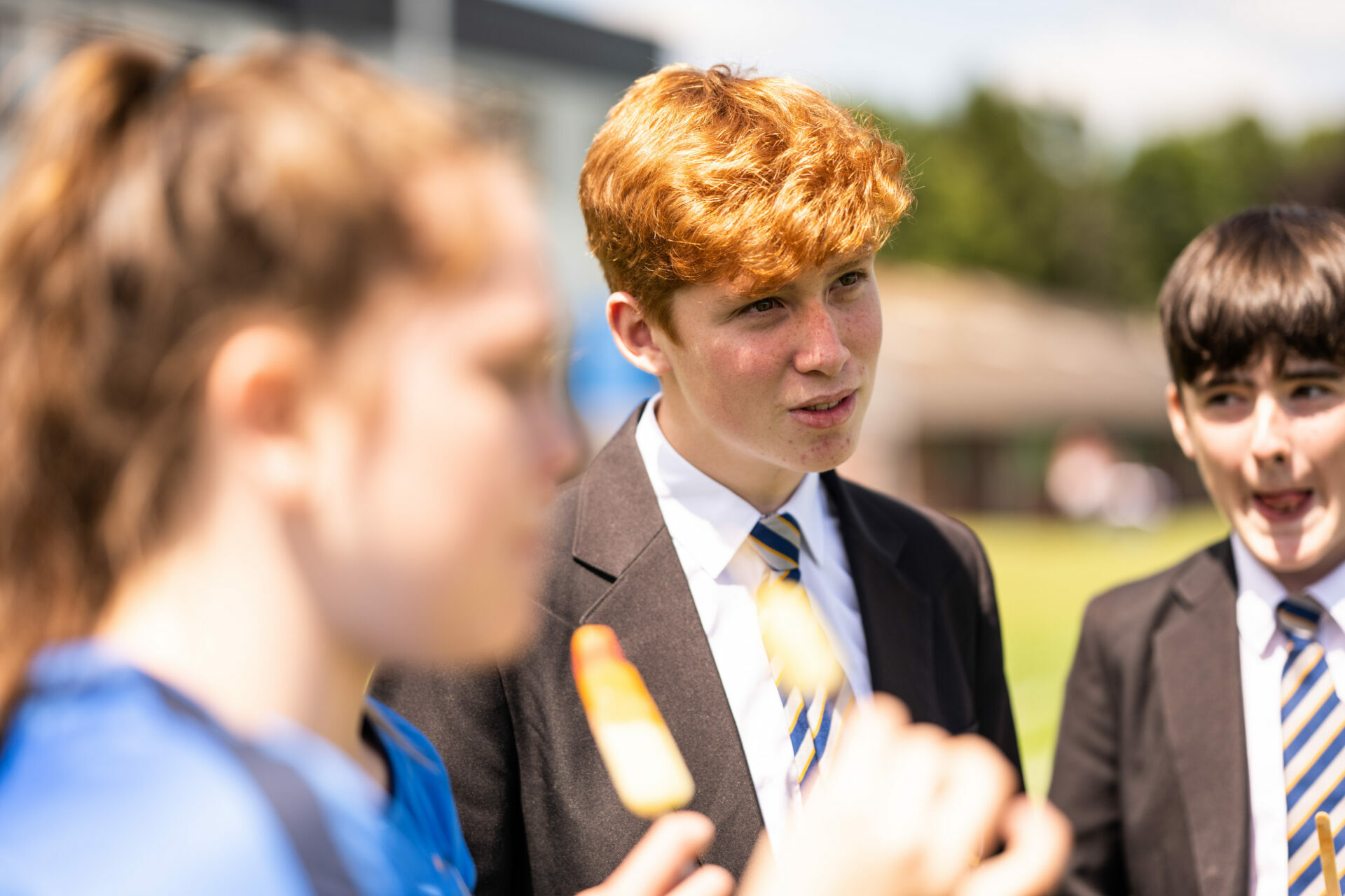 Student talking on field