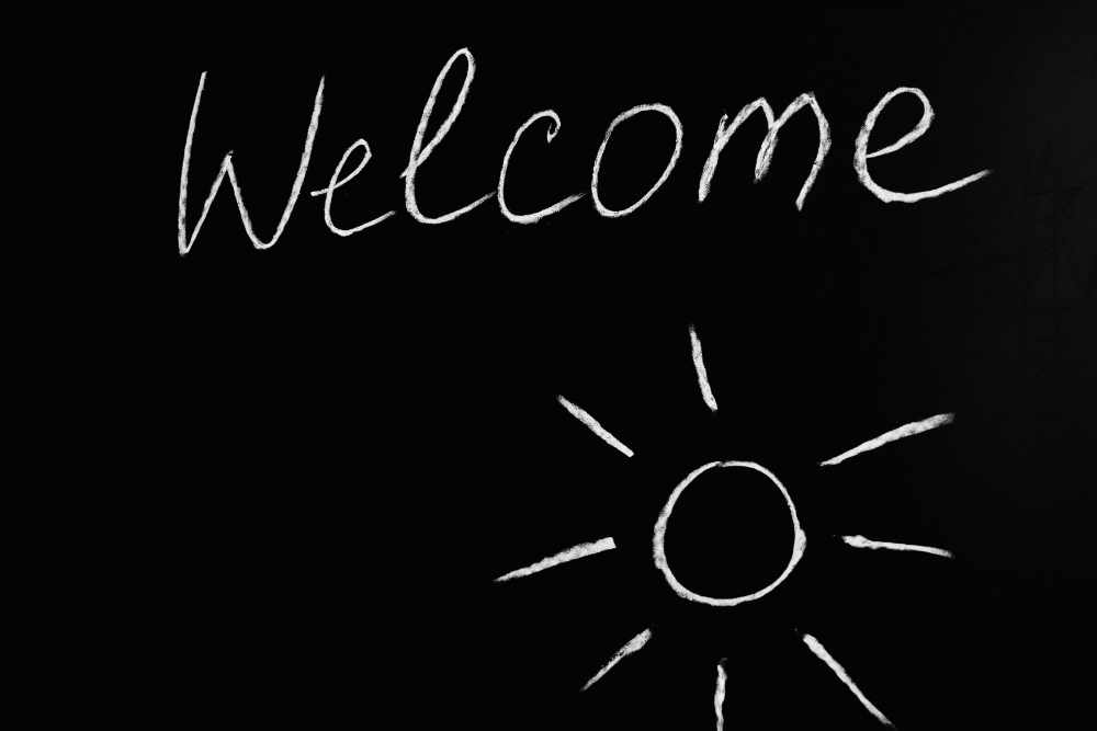 Welcome written on a chalkboard